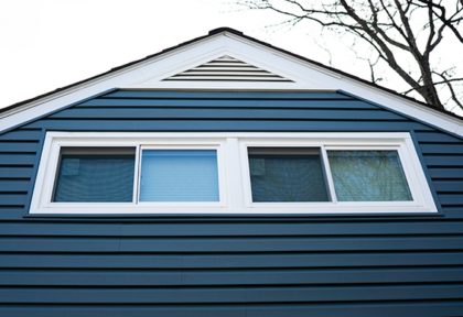 White slider windows on blue home