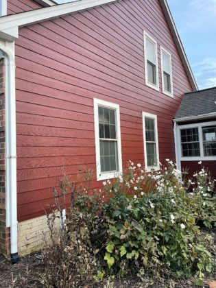 Newly installed red siding