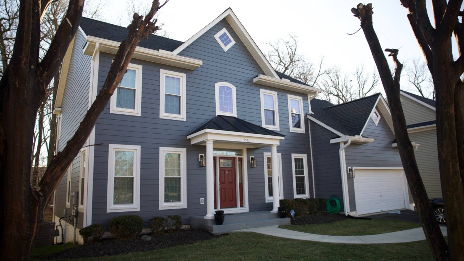 Home with Blue James Hardie Siding, new roof, gutters, and more