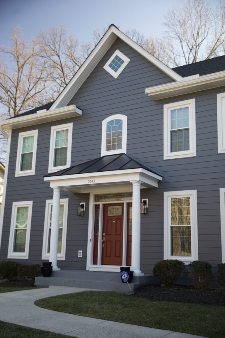 Home with Blue James Hardie Siding, new roof, gutters, and more