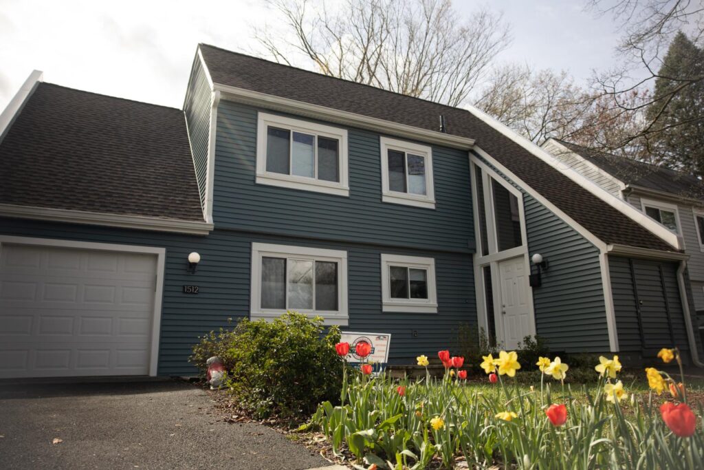 Reston home with blue vinyl installed by Presidential Exteriors