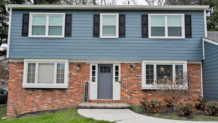 Beautiful and stunning blue James Hardie siding renovation.