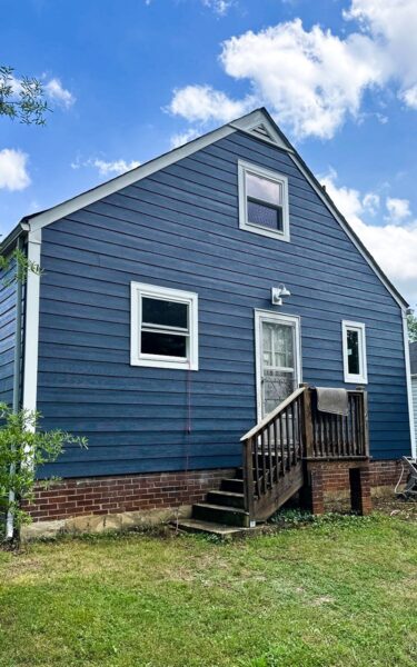 A Hyattsville, MD home exterior remodeling project with Deep Ocean James Hardie Siding and Prezi 6.0 Presidential Windows